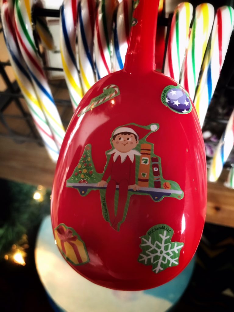 Red tongs with Elf on the Shelf stickers