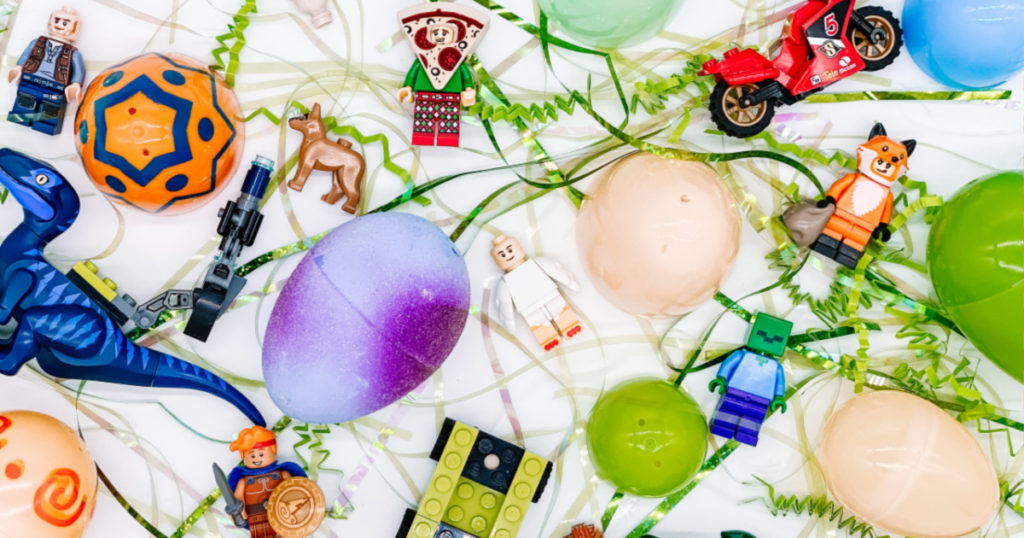 Plastic Easter eggs and LEGO figures in green plastic Easter grass