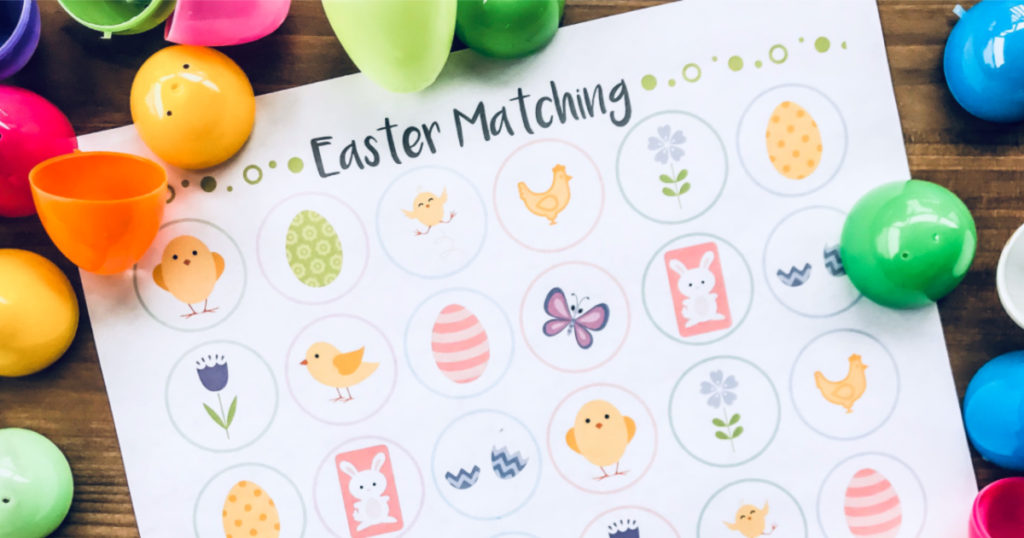 Easter Egg Matching printable on wood with colorful plastic eggs around it