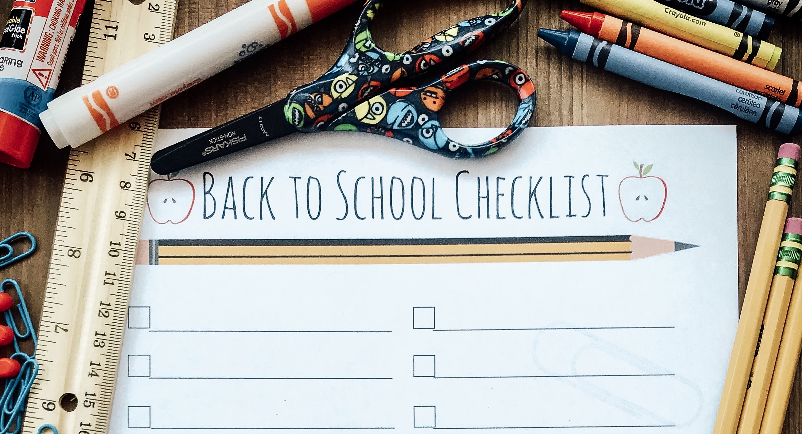 Printable Back to School Checklist surrounded by school supplies