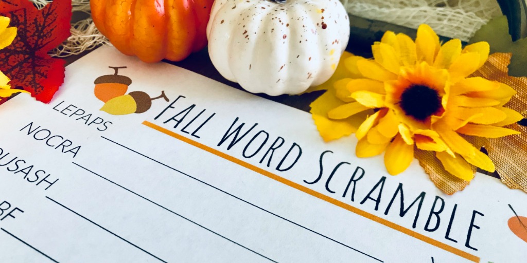 Pumpkins sitting above the Fall Word Scramble printable worksheet