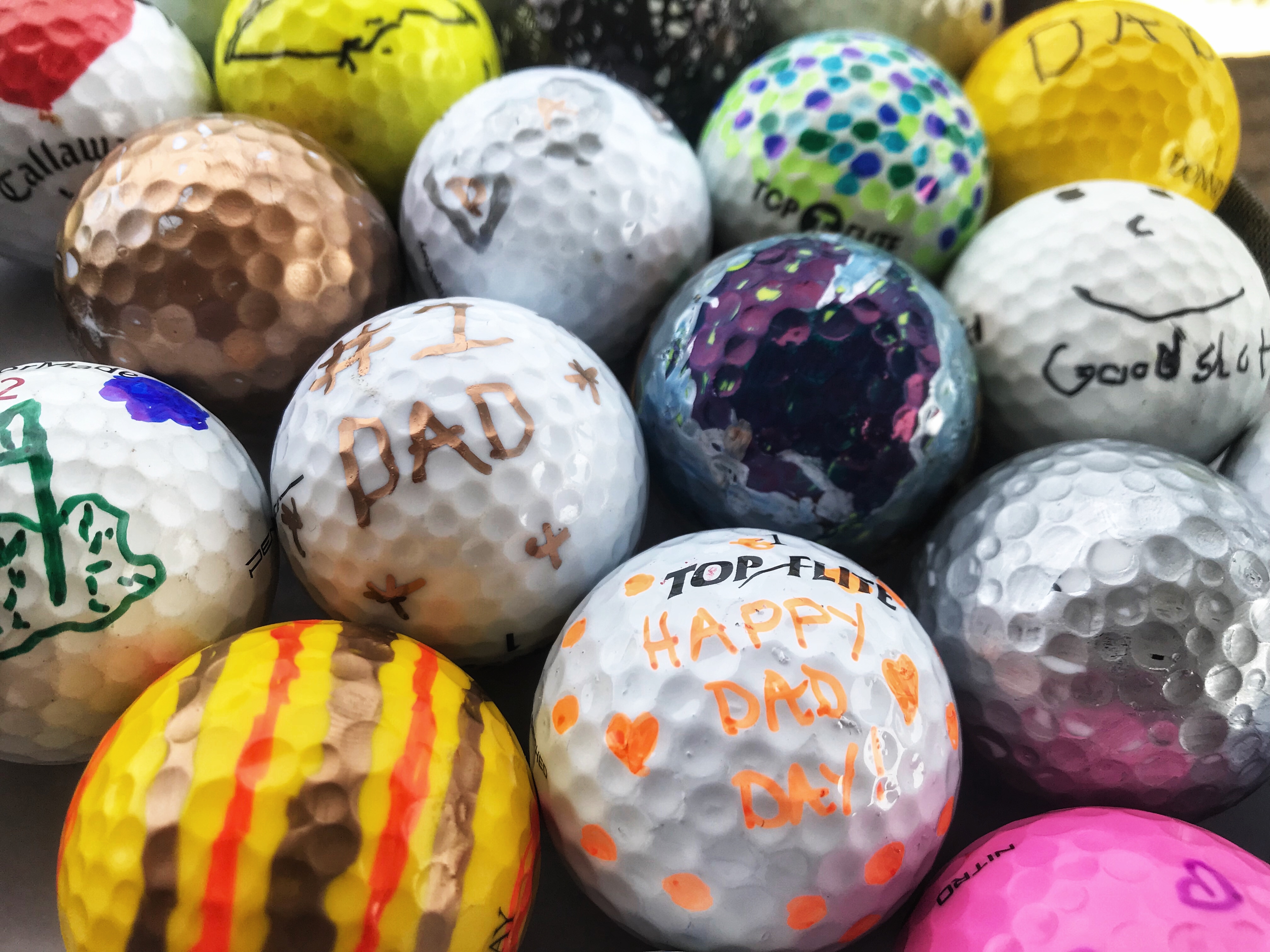 Colorful golf balls decorated for Father's Day