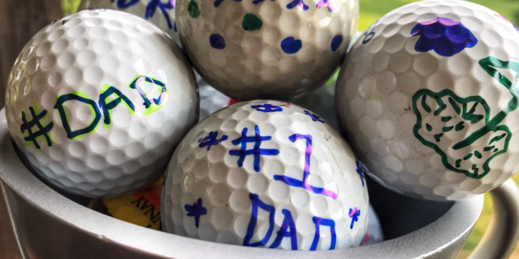 trophy holding personalized golf balls