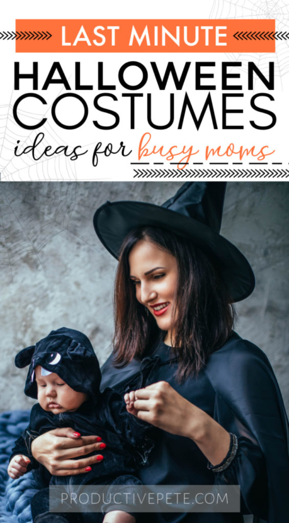 women in witch hat holding baby